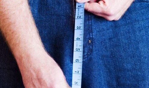 Man measures the length of the penis